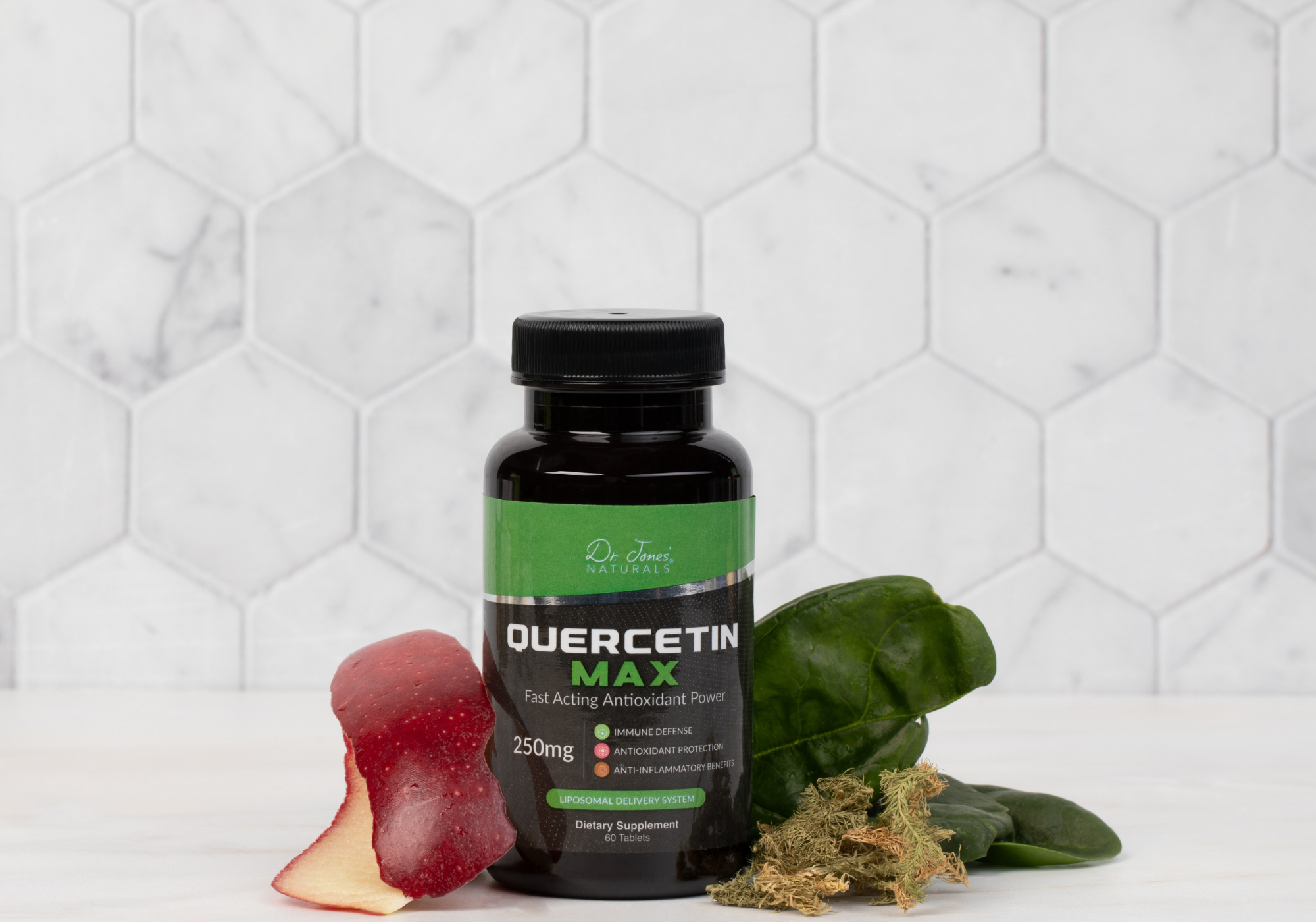 Quercetin supplement bottle with gummy bears and leaves on a white background
